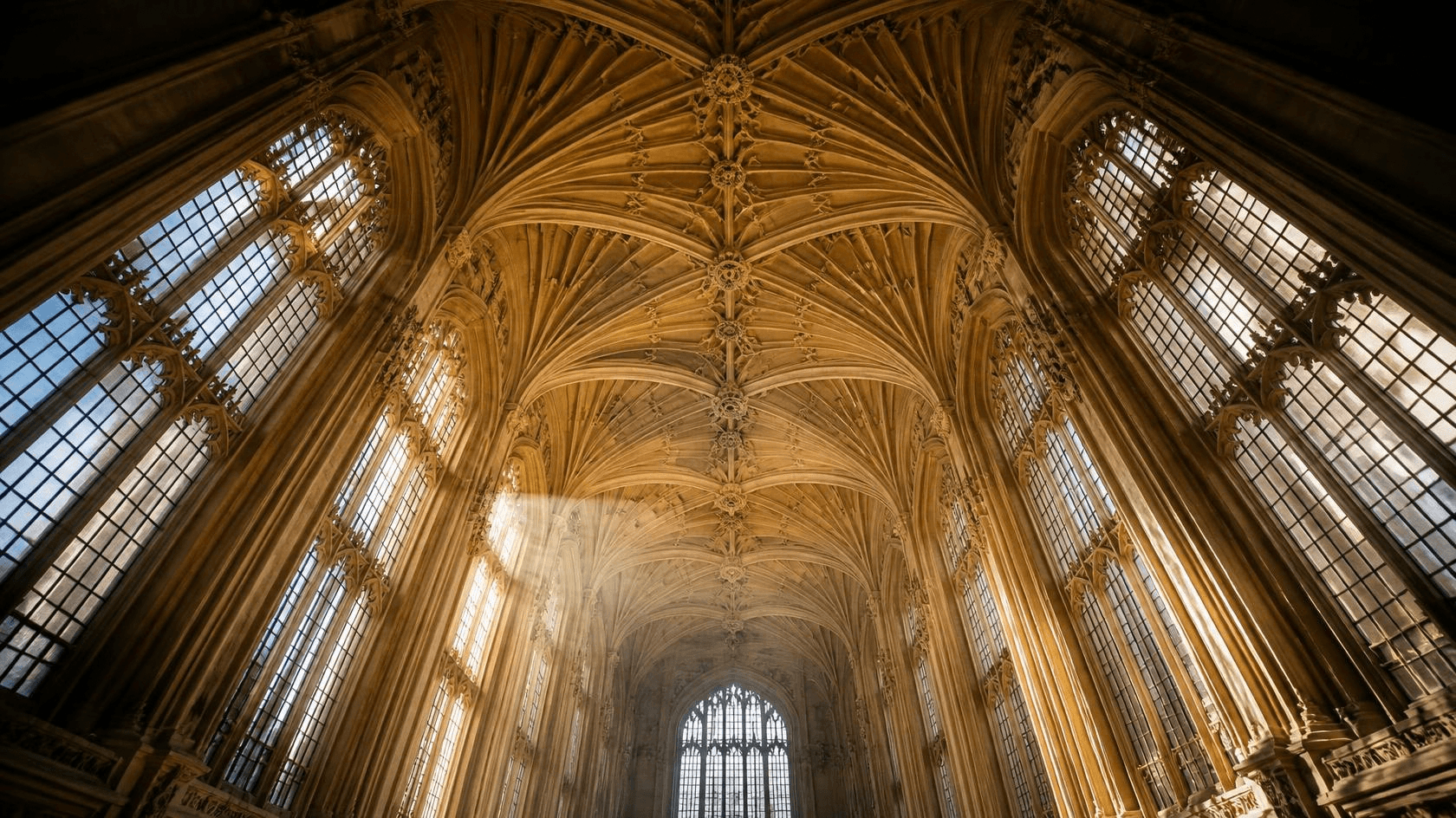 Sunlight across a vaulted chapel ceiling